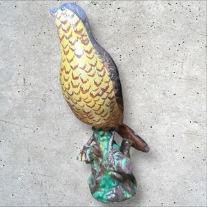 Vintage 9 inch tall decorative colorful Ceramic Bird Figurine sitting on a tree.